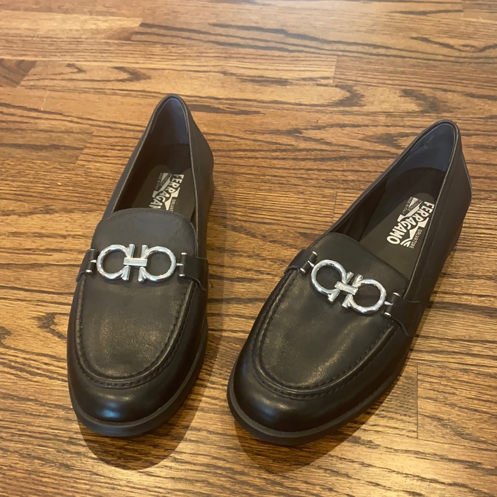 Black Ferragamo Loafer with silver buckle.   Never worn.   Size 8.5C